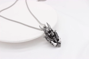 Gothic skull pendant necklace with horned helmet and crossed axes in vintage steel finish