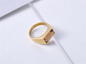 Macro shot of retro stainless steel ring with champagne rectangular gemstone inlay