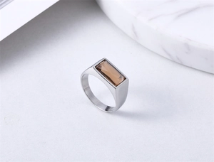 Detail of vintage champagne gemstone set in matte silver stainless steel ring