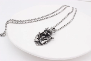 Macro view of Viking skeleton pendant with horned helmet and crossed axes detail