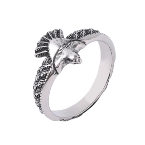 Detailed macro view of retro silver eagle ring featuring intricate feather texture