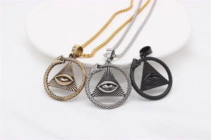 Detailed close-up of retro Eye of Providence pendants in gold, silver and matte black finish