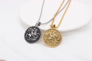 Close-up of Saint George dragon knight medals in vintage silver and gold on chains