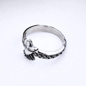 Minimalist eagle wrap ring in silver steel with detailed feather texture engraving