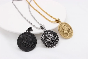 Detailed relief pendants showing Saint George and the Dragon in silver, gold, and black