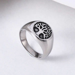 Vintage stainless steel signet ring for men featuring a detailed Tree of Life engraving