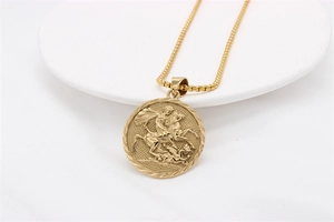 Detail view of gold-plated knight relief pendant with textured square chain link