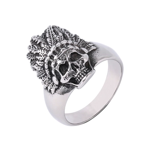 Macro view of vintage silver Indian chief skull ring with oxidized feather texture