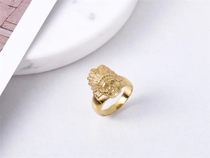 Macro shot of gold vintage Indian chief skull ring showing intricate feather crown detail