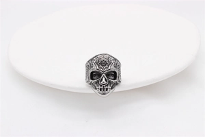 Detailed macro view of vintage stainless steel Mexican sugar skull ring for men