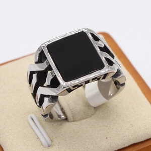 Vintage stainless steel ring for men featuring a large square black stone and woven design