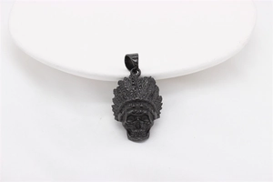 Close-up of matte black steel skull pendant with detailed Indian chief feather headdress