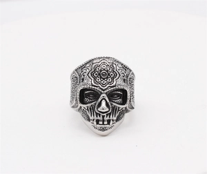 Macro detail of gothic skull ring with mandala floral engraving on the forehead