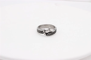 Detailed close-up of retro punk dagger sword wrap ring in silver stainless steel