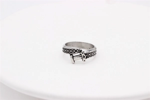 Detailed view of vintage silver steel ring with intricate dagger motif and textured pattern