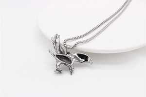 Detailed macro shot of vintage silver eagle pendant with intricate hip-hop steel textures