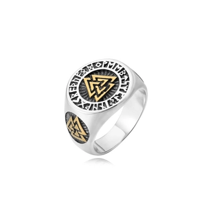 Macro shot of Viking Valknut ring featuring golden Nordic runes and vintage steel details