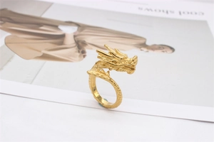 Detailed close-up of a vintage golden dragon ring with intricate scales and carvings