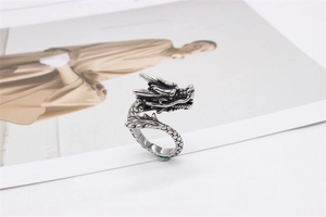 Detailed macro view of retro stainless steel dragon ring with intricate silver scale textures