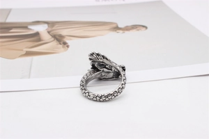Macro detail of retro dragon ring featuring intricate scales and antique silver finish