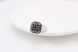 Detailed view of octagon stainless steel ring featuring a black iron cross relief
