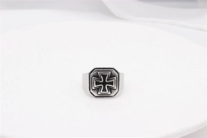 Detailed close-up of retro silver stainless steel ring with black iron cross motif