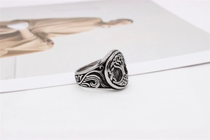 Close-up of vintage Tree of Life ring with Celtic patterns on engraved stainless steel