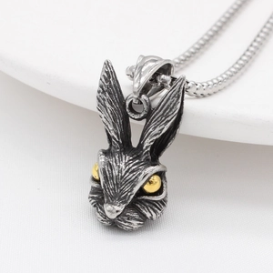 Vintage rabbit head pendant necklace in matte silver finish with gold bead eyes