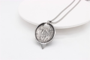 Macro detail of Rebel Alliance style eagle pendant in vintage silver stainless steel