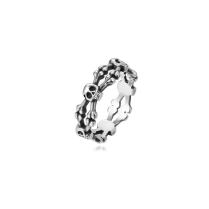 Macro detail of gothic skull ring with vintage silver finish and punk bone structure