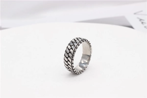 Macro view of vintage striped ring with textured chain pattern in a retro silver finish