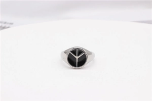 Macro detail of a minimalist peace symbol signet ring in polished stainless steel