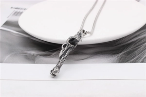 Gothic silver-tone bird skull pendant necklace with intricate bone texture details