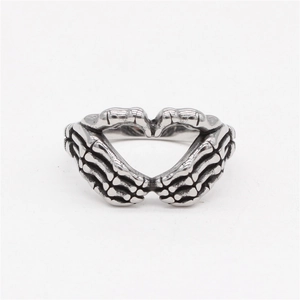 Retro stainless steel skeleton hand heart ring with punk gothic aesthetic and silver finish