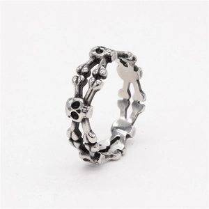 Retro gothic skull and crossbones silver metal ring with a punk style and oxidized finish