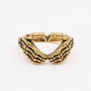 Vintage gothic golden skeleton hand heart ring made of retro style titanium steel metal