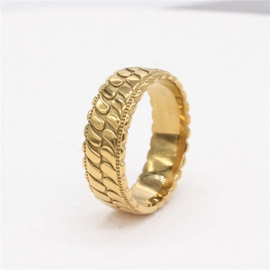 Minimalist gold textured ring with vintage striped pattern on a clean white background