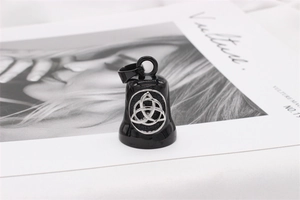 Detail of black Viking bell pendant featuring a silver Triquetra knot and large bail ring
