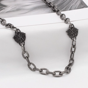 Vintage oxidized silver steel necklace featuring angel relief coins and heavy oval link chain