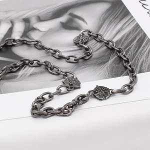Vintage oxidized titanium steel necklace featuring embossed goddess warrior pendants