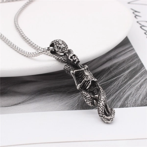 Retro stainless steel necklace featuring a detailed snake coiled around a skull pendant