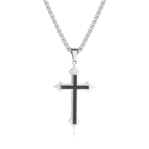 Macro shot of silver stainless steel cross pendant with black center and box chain
