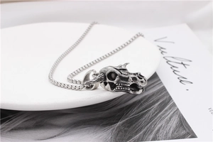 Macro shot of retro stainless steel bull skull pendant with oxidized vintage texture