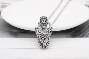 Macro detail of Nordic Viking Valknut pendant with antique silver finish and forge texture