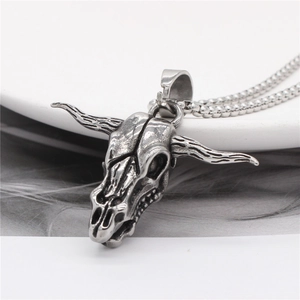 Retro bull skull pendant necklace in oxidized steel with long horns on a bead chain