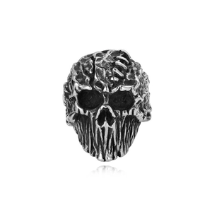Macro shot of a vintage punk skull ring with detailed brain textures and blackened finish