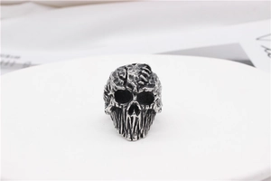 Macro shot of vintage mummy skull ring with aged finish and gothic metal textures