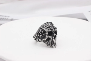 Macro shot of gothic silver skull ring with oxidized vintage bone texture details