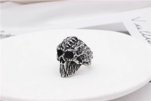 Detailed view of a vintage mummy skull ring with dark punk style and stitched texture