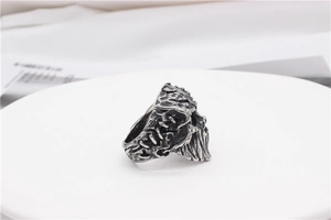 Macro shot of vintage silver skull ring with gothic 3D relief details on display